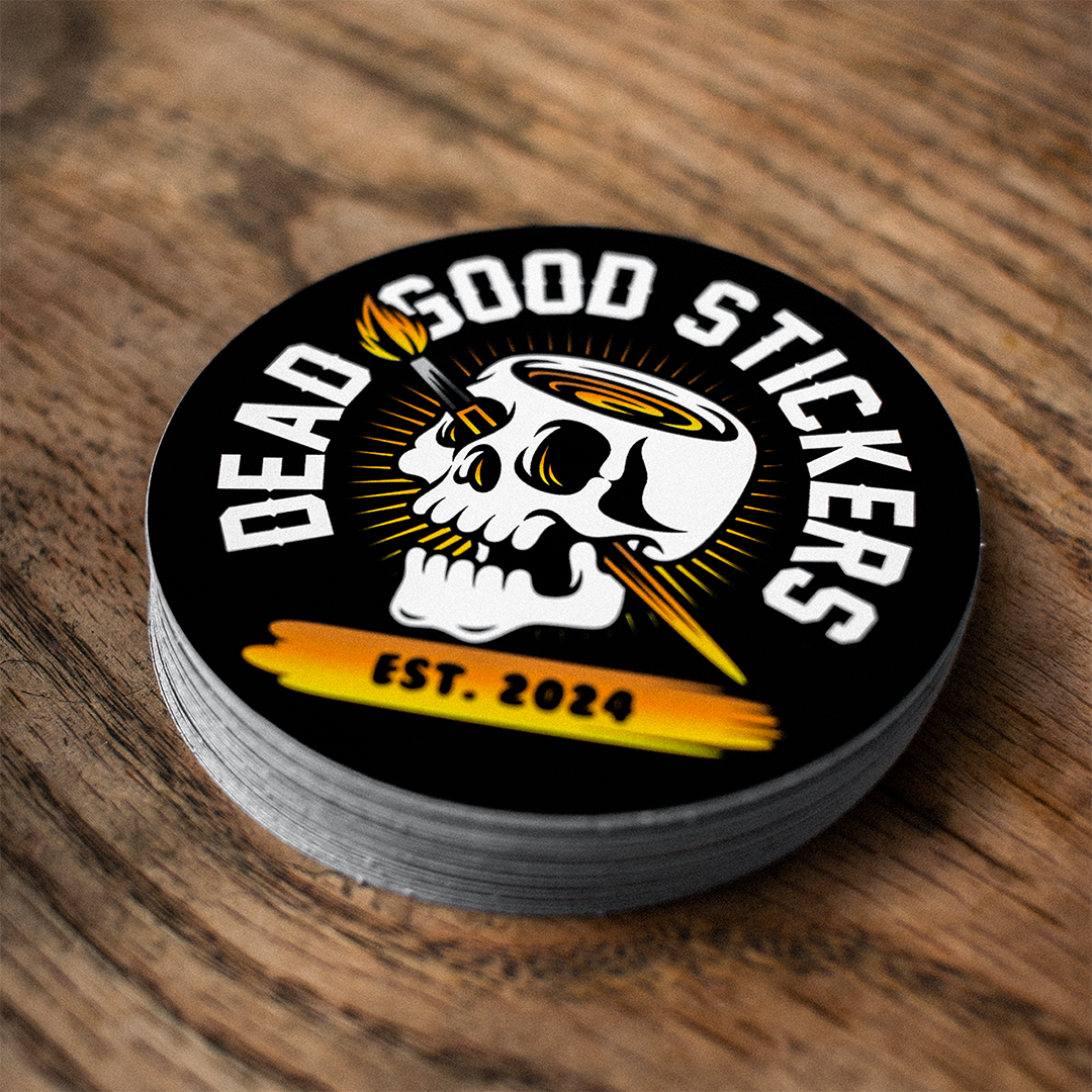 circle stickers with the Deadgood Stickers logo on a wooden background