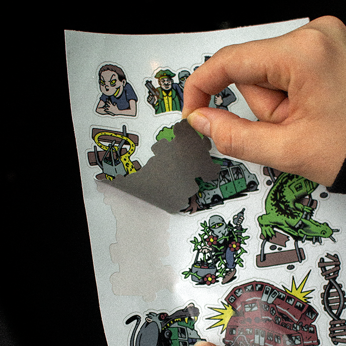 custom sticker sheets being peeled with various stickers for analog delinquents