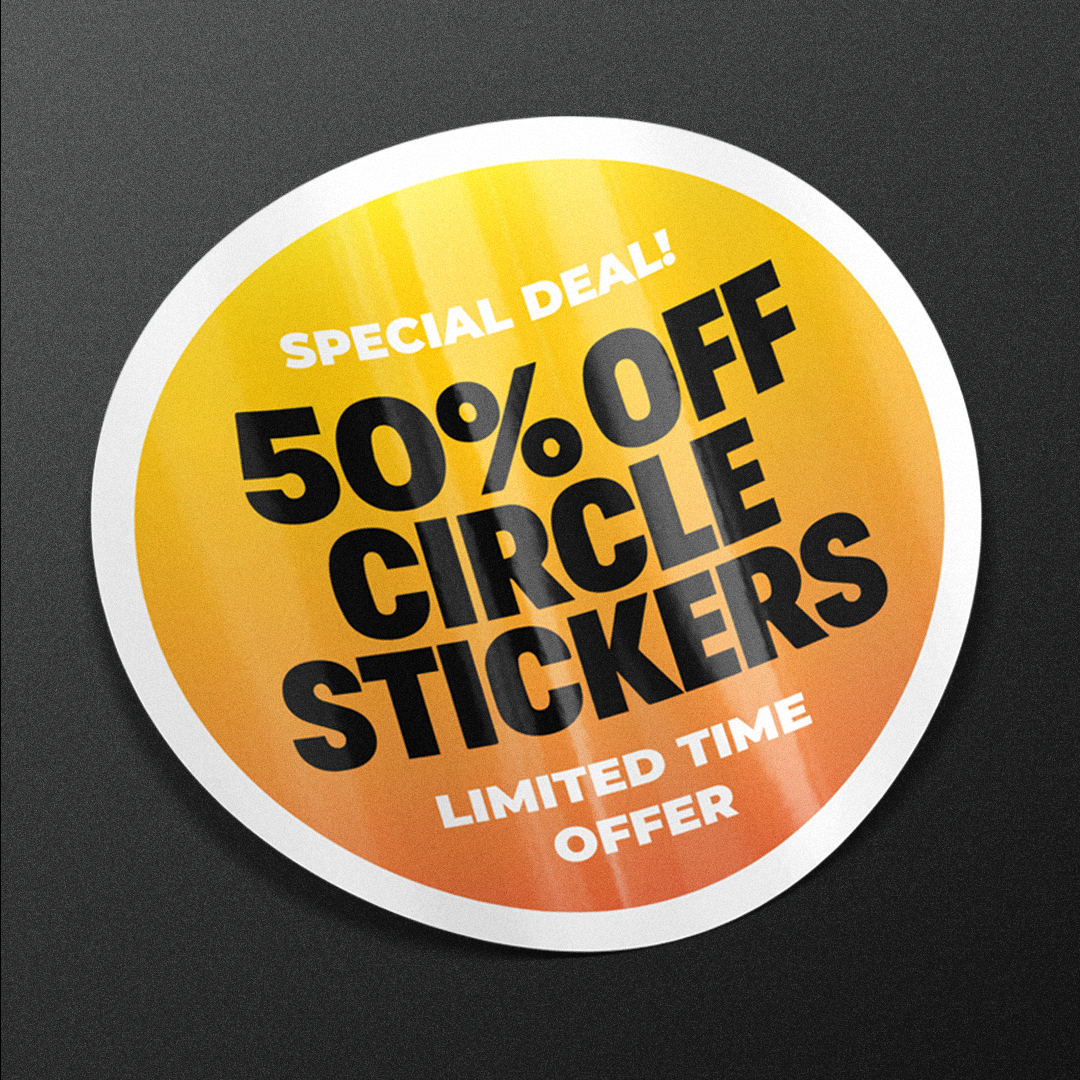 Round yellow sticker with black text on a black background