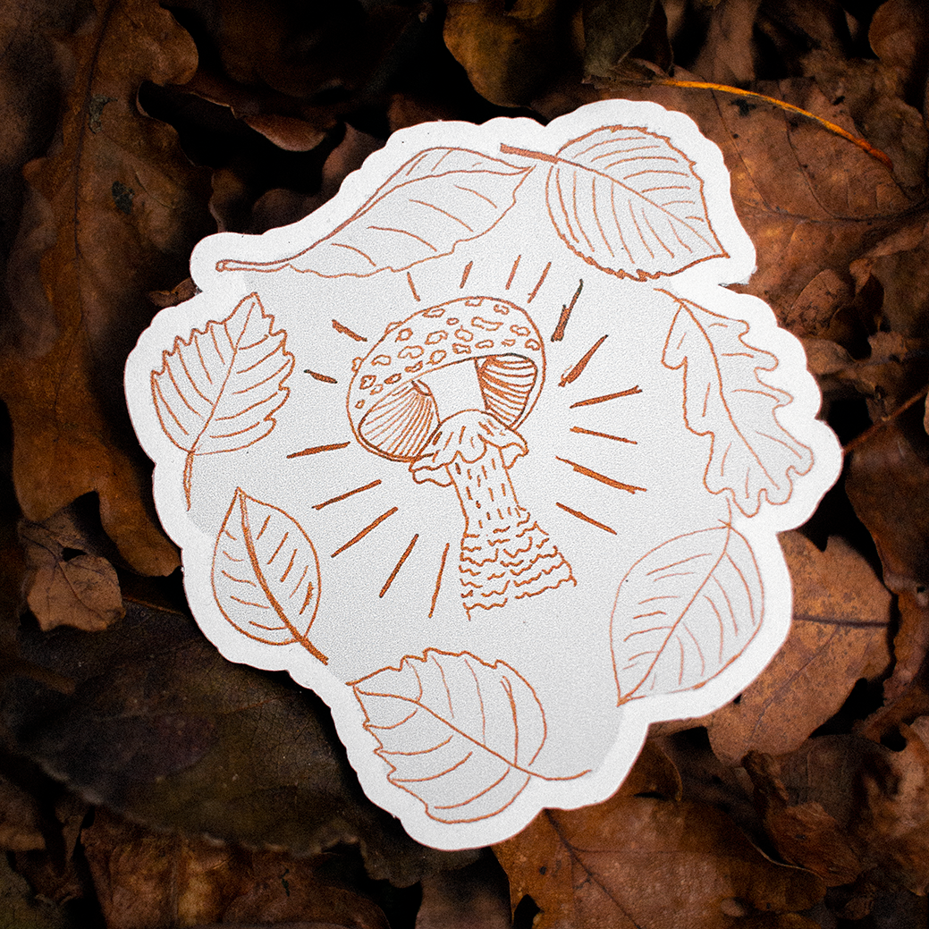 a custom shaped sticker of a mushroom with a matte finish